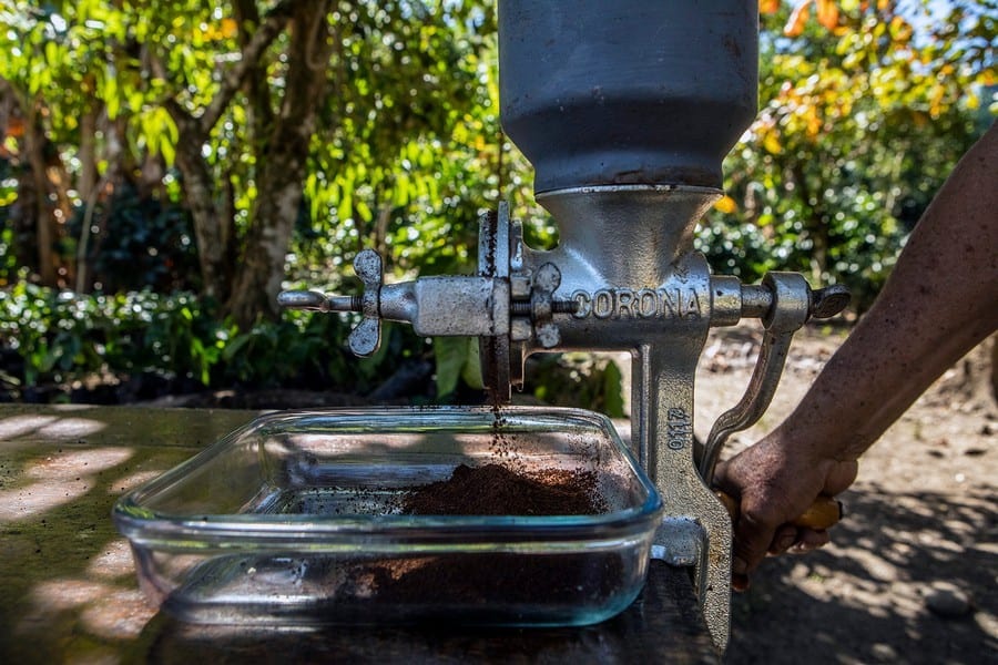 grinding the coffee, Chocolate and Coffee at the traditional Finca Doña Julia