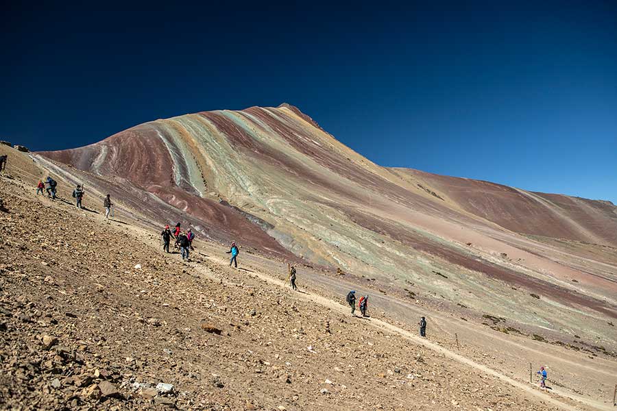 Trek to Rainbow Mountain with view at Vinicunca in the background