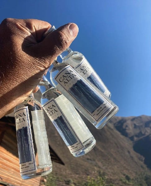bottles of Caña Alta of the Destileria Andina, visit Machu Picchu sustainably