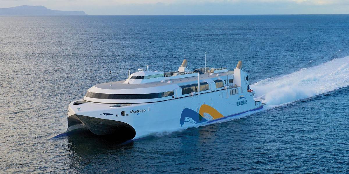 The picture offers a top view of the Buquebus catamaran, a popular mode of transportation for tourists traveling from Buenos Aires to Colonia del Sacramento in Uruguay. The catamaran glides smoothly across the ocean pass, providing a scenic and enjoyable journey for passengers.