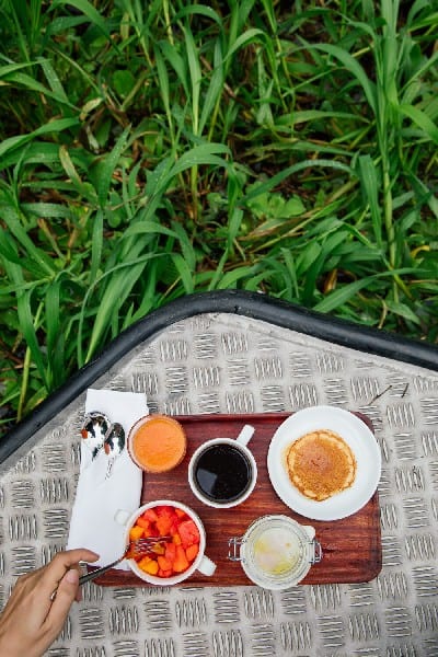 Breakfast in the middle of the jungle with pancake, coffee, fruites and juice on the Amazon Aria Cruise.