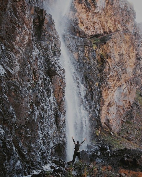 huge Waterfall with tourist infront in the Cajon del Penon