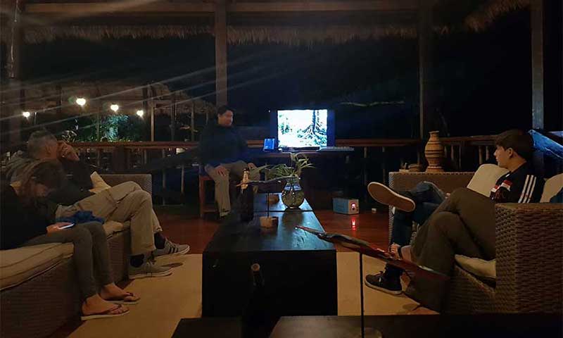 Guests at Tambopata Research Center (TRC) in the Peruvian jungle listening to the briefing on a-la-carte activities during the stay