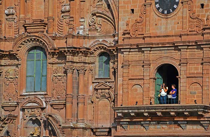 A traveler photographing from La Compania Church