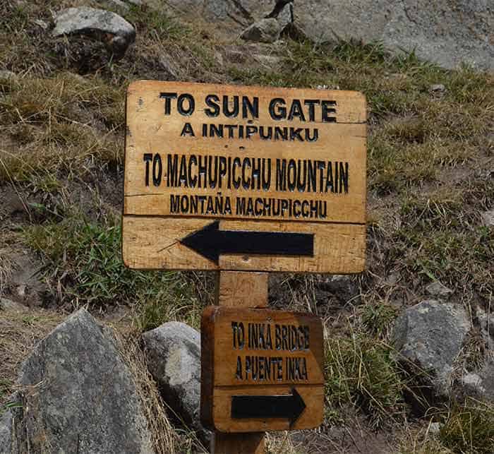 Sign in Machu Picchu showing the direction to get to Inti Punku Sun Gat