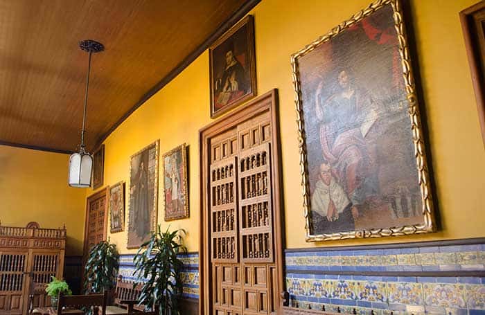 Inner courtyard with colonial paintings at Casa Aliaga