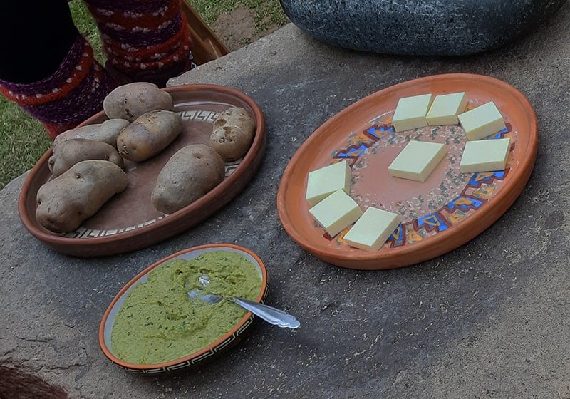 Boiled potatoes and cheese for tasting at Misminay community in the Sacred Valley   