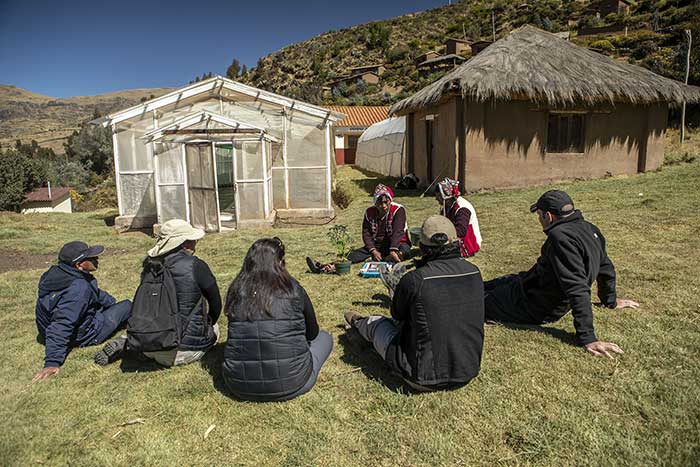 Setours team listening to the explanations of the community in the Potato Park 