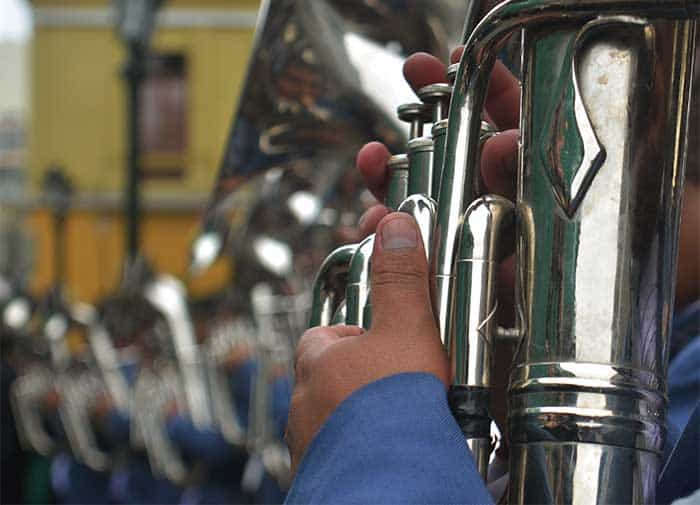 Musicians playing wind instruments during the Candelaria celebration in Puno