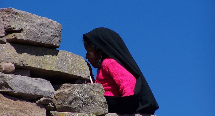 Lake Titicaca & Puno - Little girl wearing traditional headdress on Taquile Island  