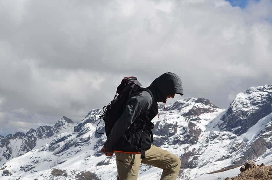 Hiker stopping to breath at the last leg of Rainbow Mountain Hike