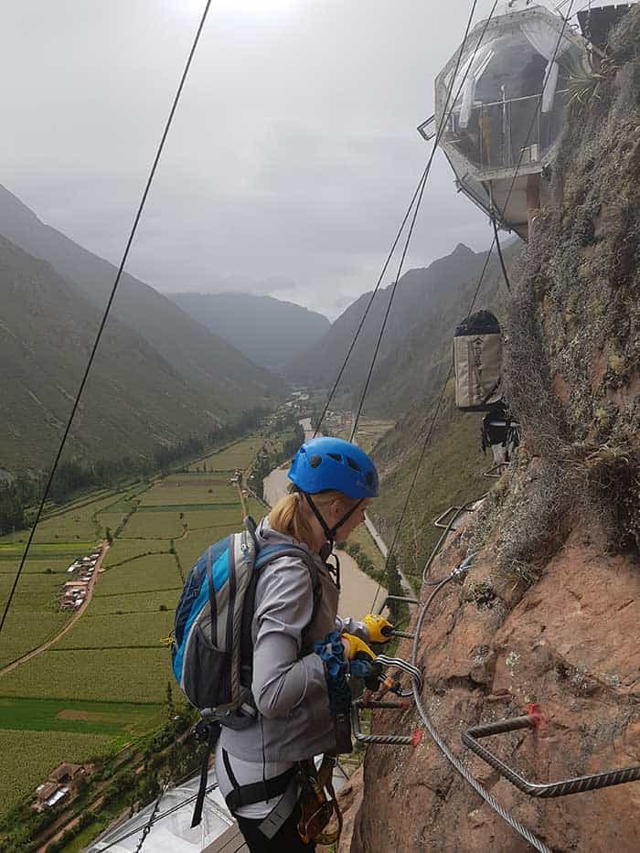 Maria climbing the via ferrata up to the Skylodge, almost there 