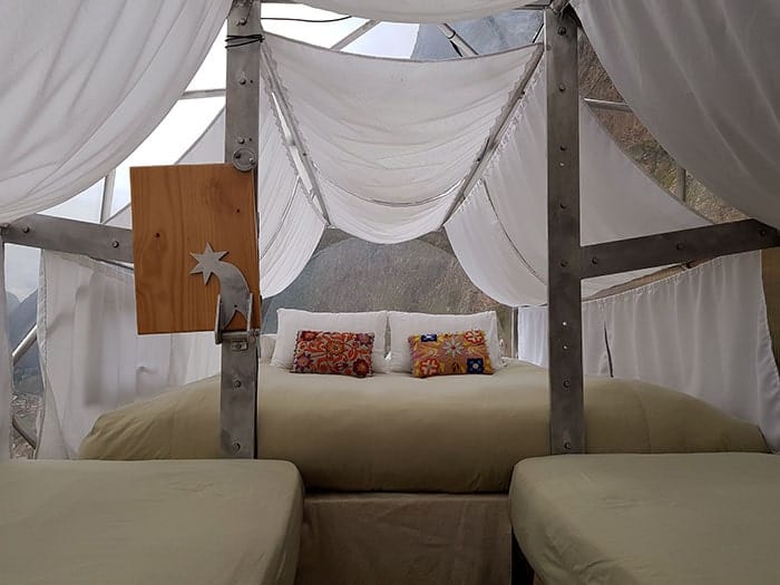 Three green beds at one of the pods of Skylodge overlooking the Sacred Valley of the Incas