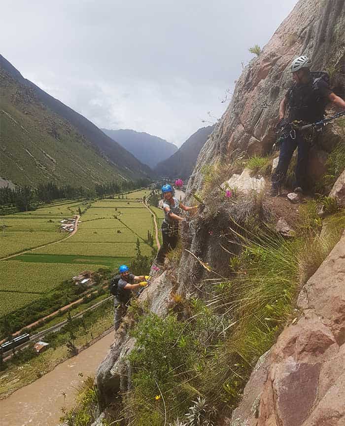 A couple climbing up to the Skylodge Sacred Valley 