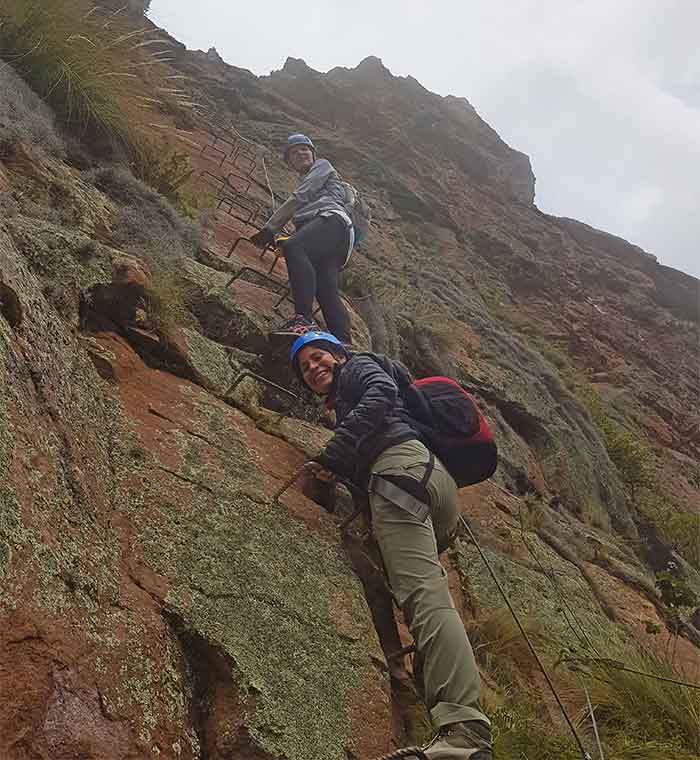2 climbers on their way up along a via ferrata to the Skylodge