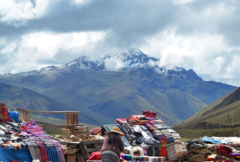 Views from the snow-capped Andes at La Raya Pass and a souvenir seller