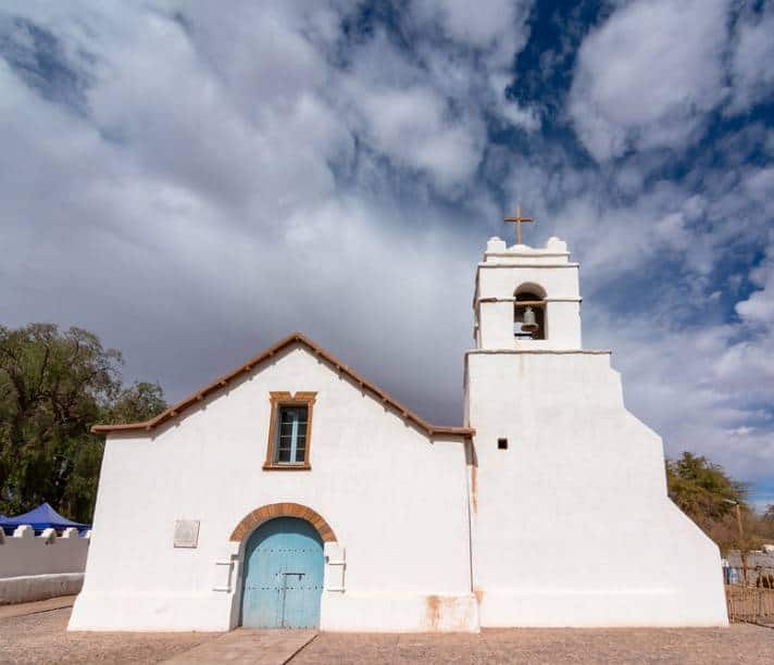 White washed church in San Pedro de Atacama built with  cacti and adobe mud bricks
