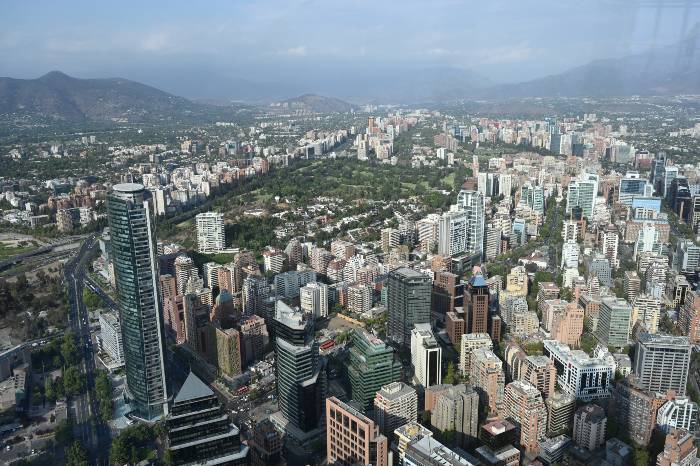 Skyscrappers in Santiago de Chile with the Andean mountains as backdrop, aerial view from Sky Costanera