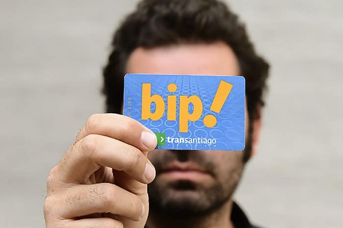 Santiago Like a Local - Man holding a BIP metro card