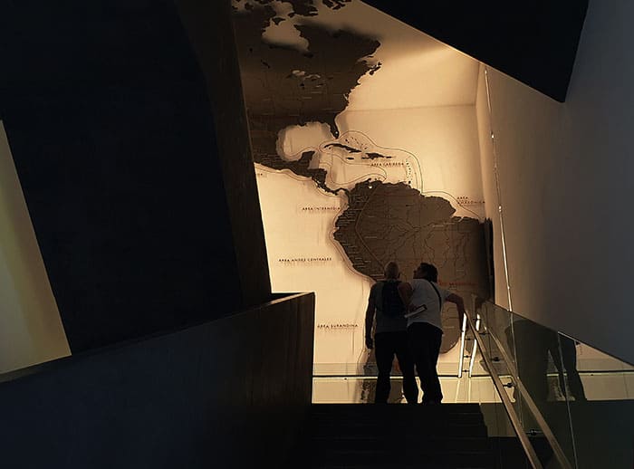 2 visitors watching the South American map at the Pre-Columbian Museum of Art, Santiago Chile
