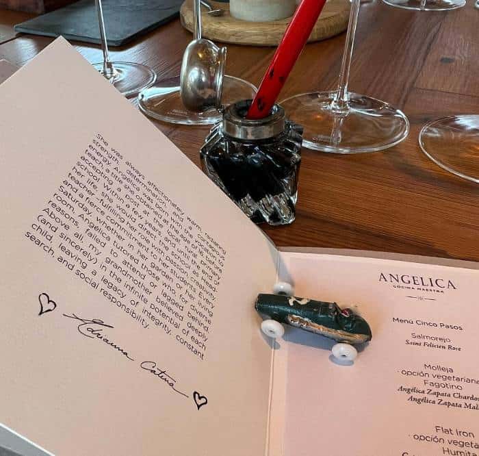an old toy car placed on a new menu carrying the name of the restaurant, Angelica and the introduction to its concept