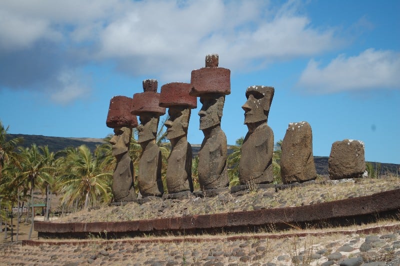 Seven moais statues standing on a ceremonial platform on Anakena Beach (Easter Island)