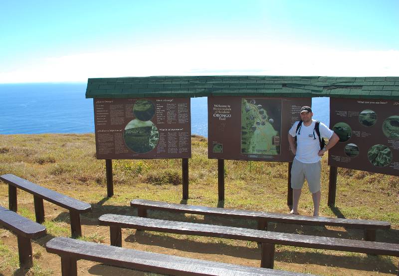 peter stadning in front of information boards at orongo